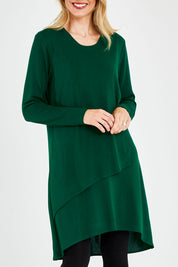 Model Kelly wearing size 10 of the Overlay Tunic in colour Forest (Green), from the front, cropped image