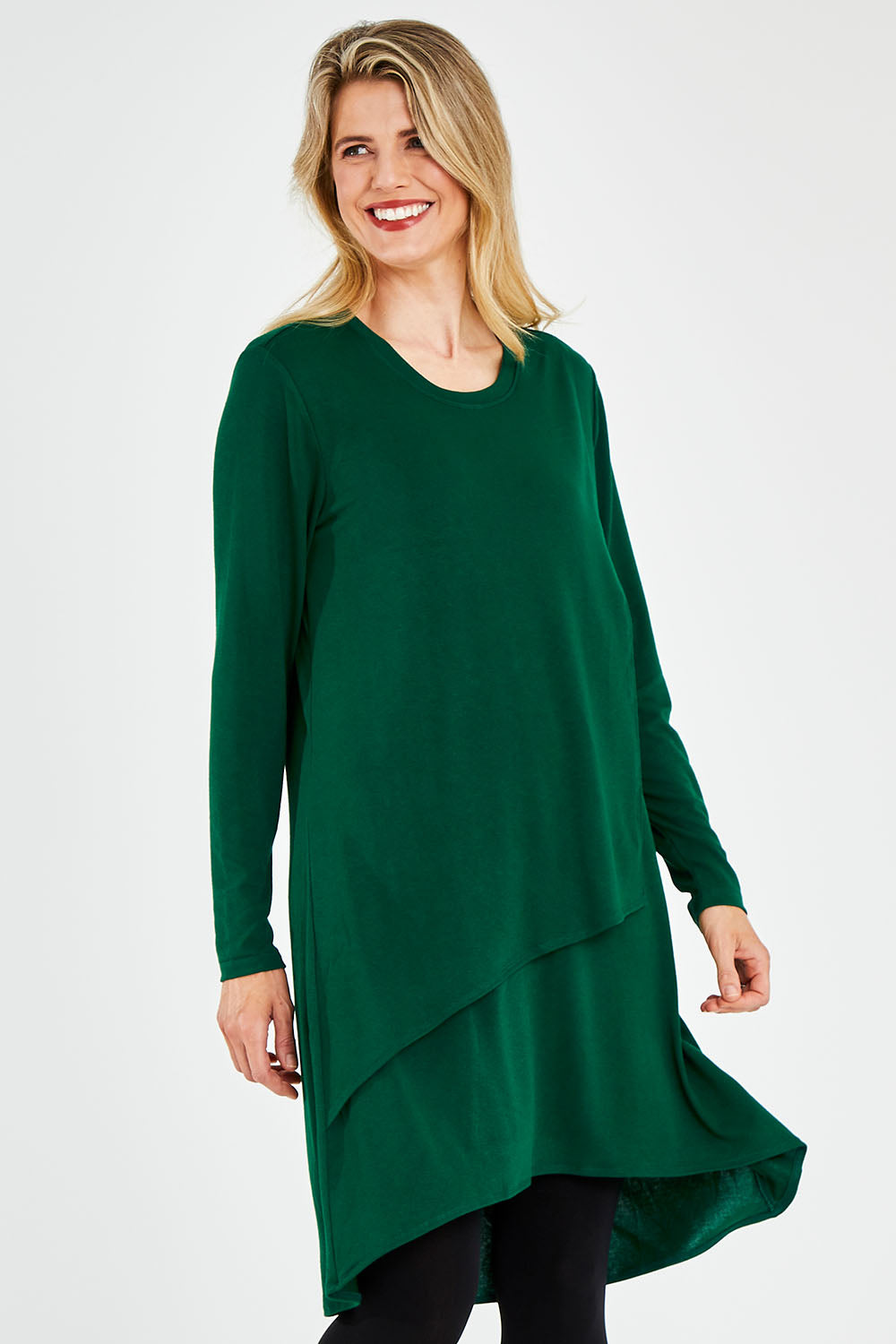 Model Kelly wearing size 10 of the Overlay Tunic in colour Forest (Green), from the front, cropped image