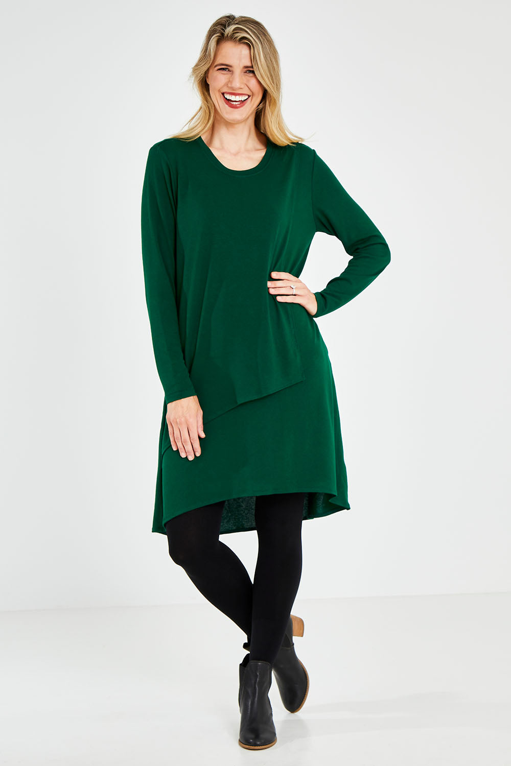 Model Kelly wearing size 10 of the Overlay Tunic in colour Forest (Green), from the front, showing the whole outfit