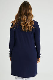 Model Laura wearing size 14 of the Overlay Tunic in colour Navy (Blue), from the back