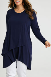 Model Laura wearing size 14 of the Overlay Tunic in colour Navy (Blue), from the front, cropped image