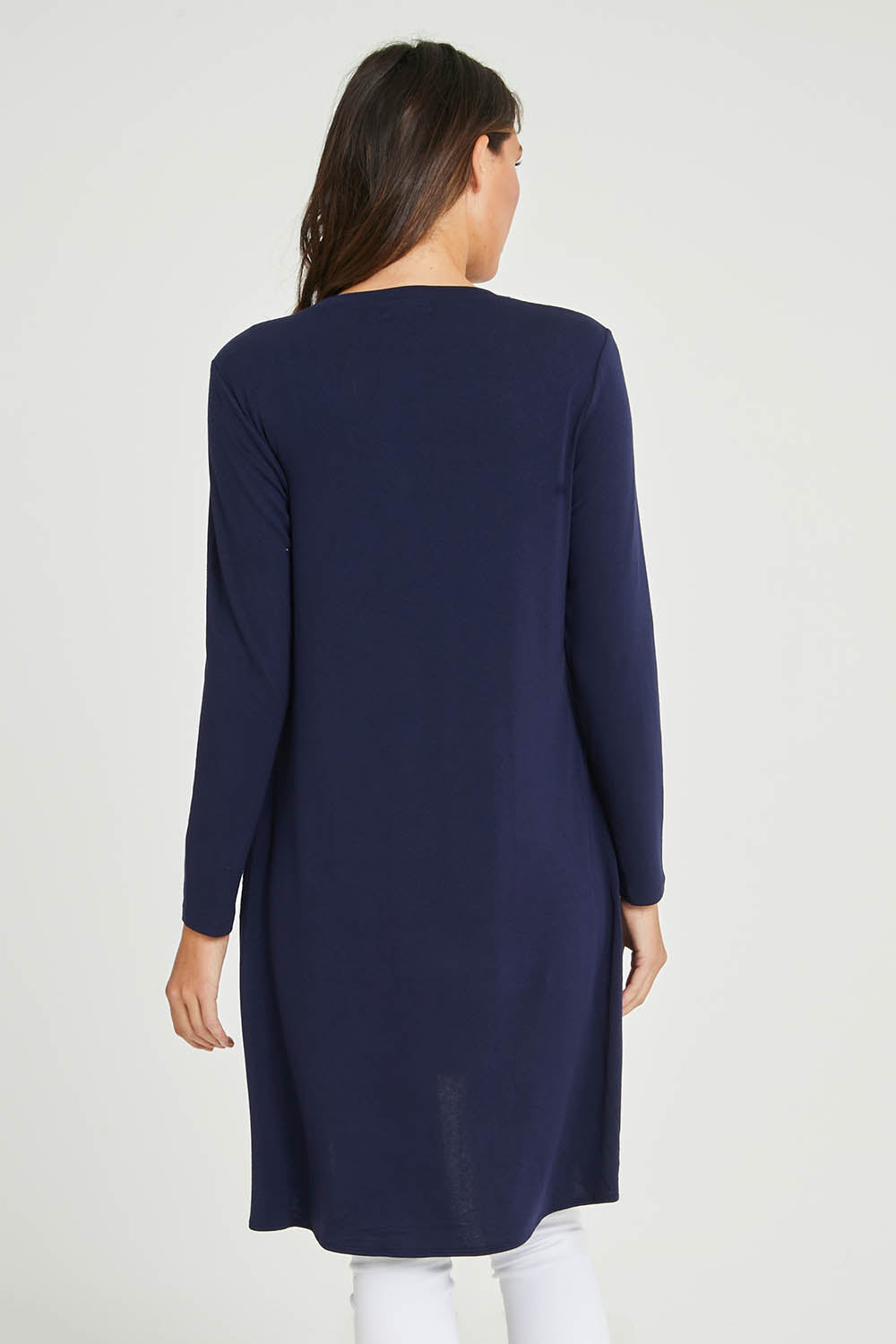Model Madeline wearing size 10 of the Overlay Tunic in colour Navy (Blue), from the back