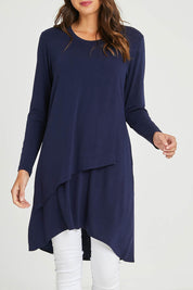 Model Madeline wearing size 10 of the Overlay Tunic in colour Navy (Blue), from the front, cropped image