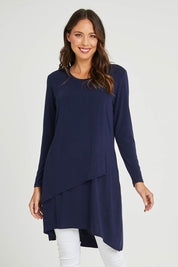 Model Madeline wearing size 10 of the Overlay Tunic in colour Navy (Blue), from the front, cropped image