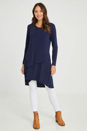 Model Madeline wearing size 10 of the Overlay Tunic in colour Navy (Blue), from the front, showing the whole outfit