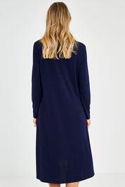 Model Kelly wearing size 10 of the Overlay Dress in colour Navy (Blue), from the back
