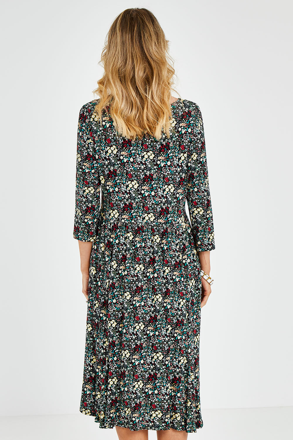 Model Kelly wearing size 10 of the Jessie 3/4 Sleeve Dress in colour Ditsy (Blue), from the back
