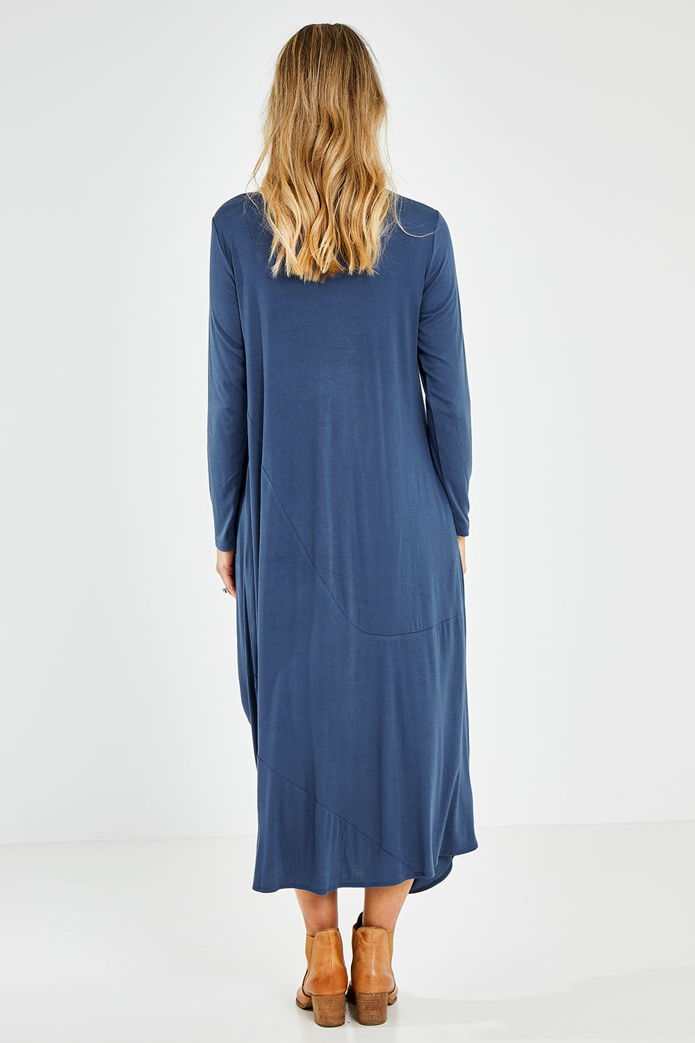 Model Kelly wearing size 10 of the Jo Jo Core Dress in colour Petrol (Blue), from the back