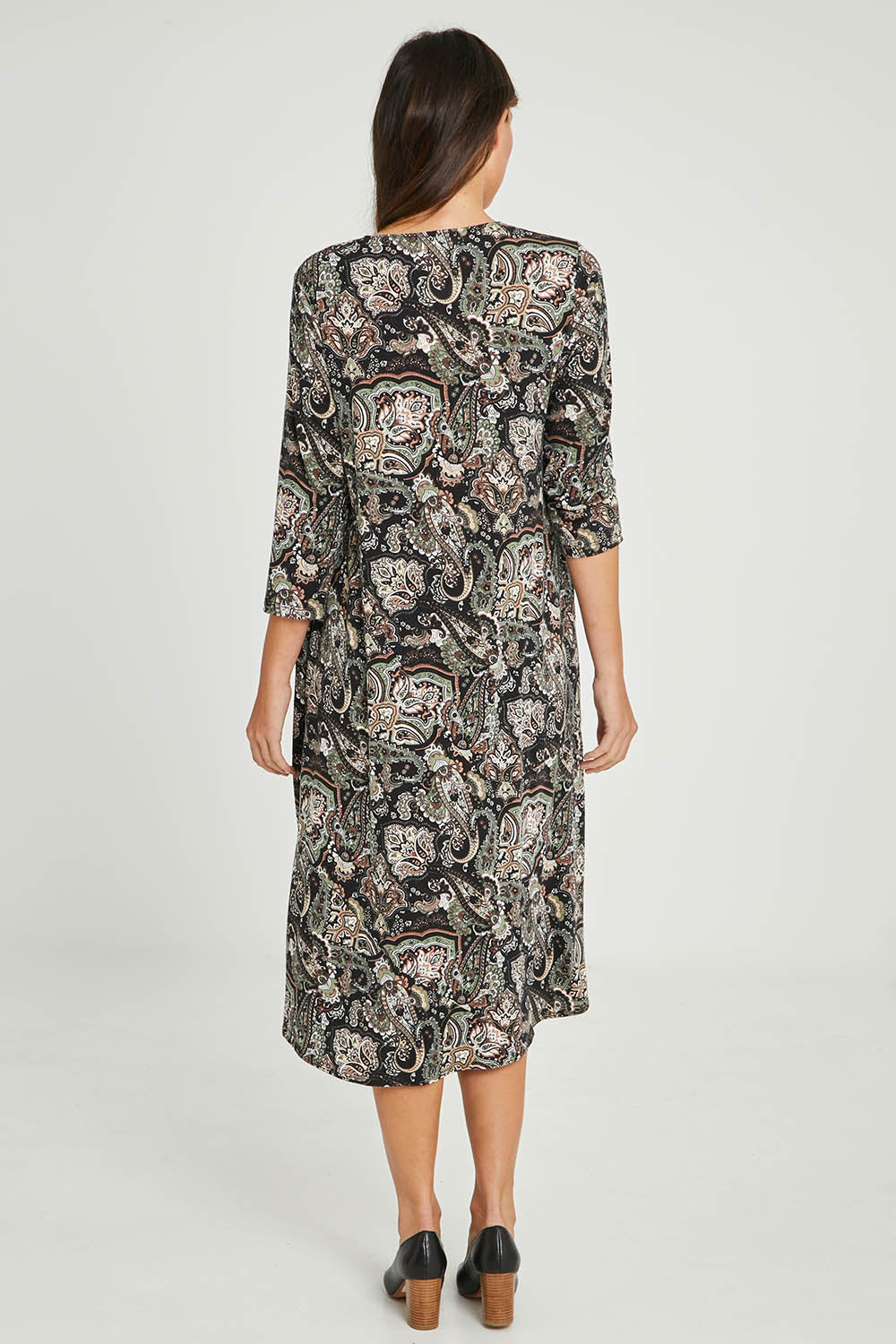 Model Madeline wearing size 10 of the Jo Jo Print Jersey Dress in colour Green (Green), from the back