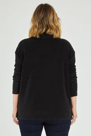 Model Jess wearing size 14 of the Micro Fleece Cowl in colour Black (Black), from the back