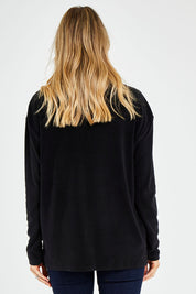 Model Kelly wearing size 10 of the Micro Fleece Cowl in colour Black (Black), from the back