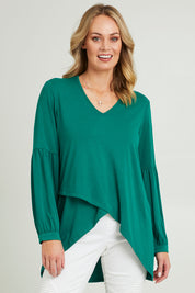 Model Grace wearing size 10 of the Hi Lo Knit Tunic in colour Forest (Green), from the front, cropped image