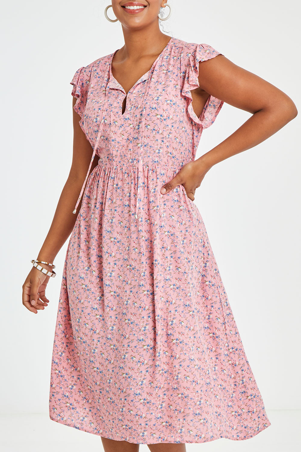 Model Noli wearing size 14 of the Penny Dress in colour Pink (Pink), from the front, cropped image