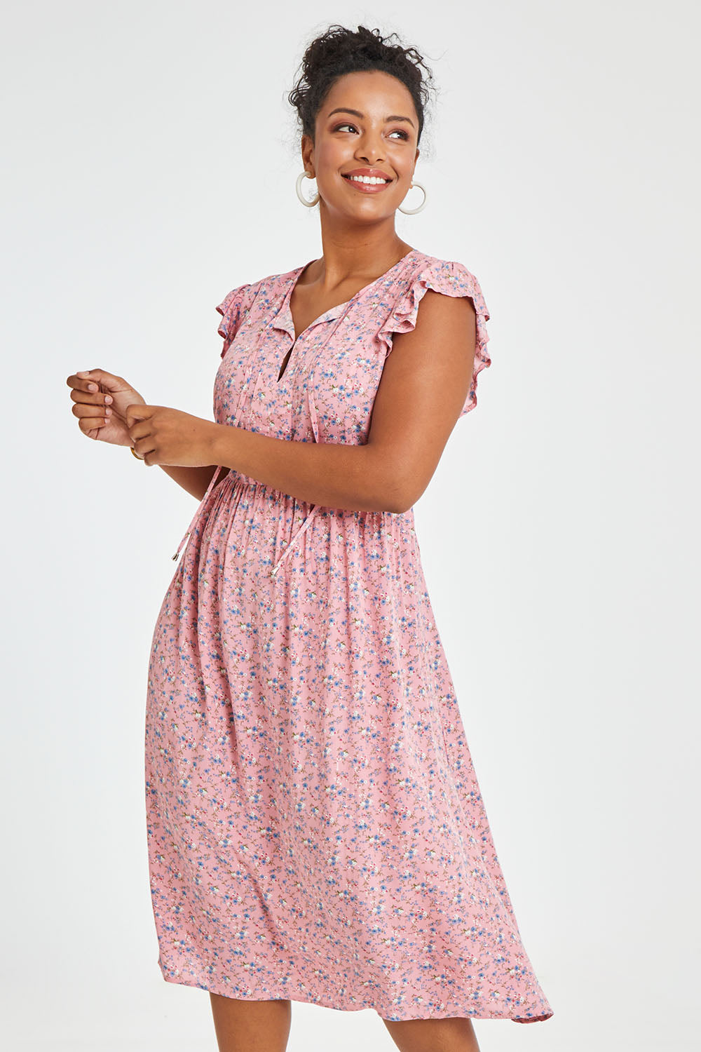 Model Noli wearing size 14 of the Penny Dress in colour Pink (Pink), from the front, cropped image