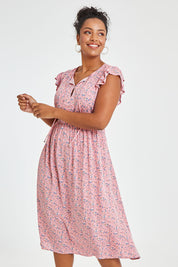 Model Noli wearing size 14 of the Penny Dress in colour Pink (Pink), from the front, cropped image