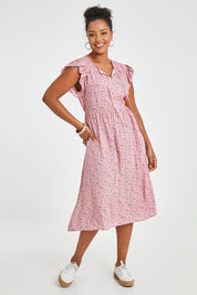 Model Noli wearing size 14 of the Penny Dress in colour Pink (Pink), from the front, showing the whole outfit
