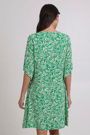Model Madeline wearing size 10 of the Sun Dress in colour Greentea (Green), from the back