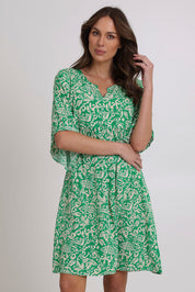 Model Madeline wearing size 10 of the Sun Dress in colour Greentea (Green), from the front, cropped image