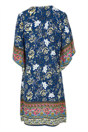 Product shot of the Sun Dress in colour Navyfloral (Blue), from the back