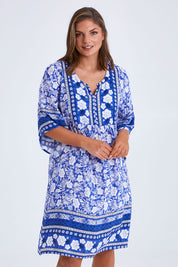 Model Monique wearing size 14 of the Sun Dress in colour Blue (Blue), from the front, cropped image