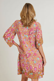 Model Grace wearing size 10 of the Sun Dress in colour Floral, from the back