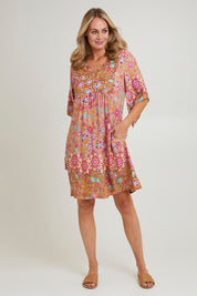 Model Grace wearing size 10 of the Sun Dress in colour Floral, from the front, showing the whole outfit