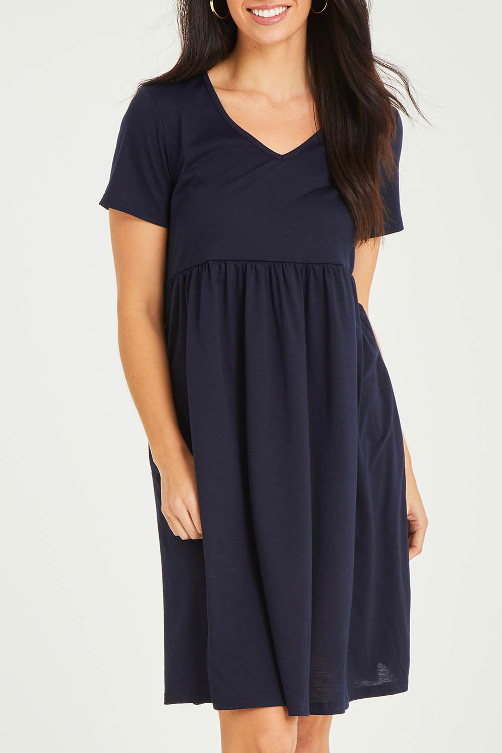 Model Stacey wearing size 10 of the Short Sleeve Holiday Dress in colour Navy (Blue), from the front, cropped image