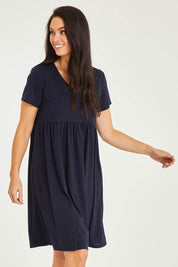 Model Stacey wearing size 10 of the Short Sleeve Holiday Dress in colour Navy (Blue), from the front, cropped image
