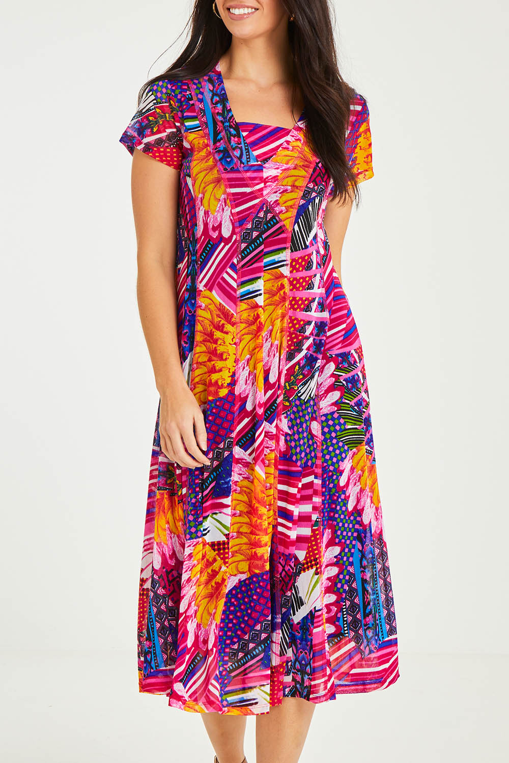 Model Stacey wearing size 10 of the Panel Mesh Dress in colour Hotpink (Pink), from the front, cropped image