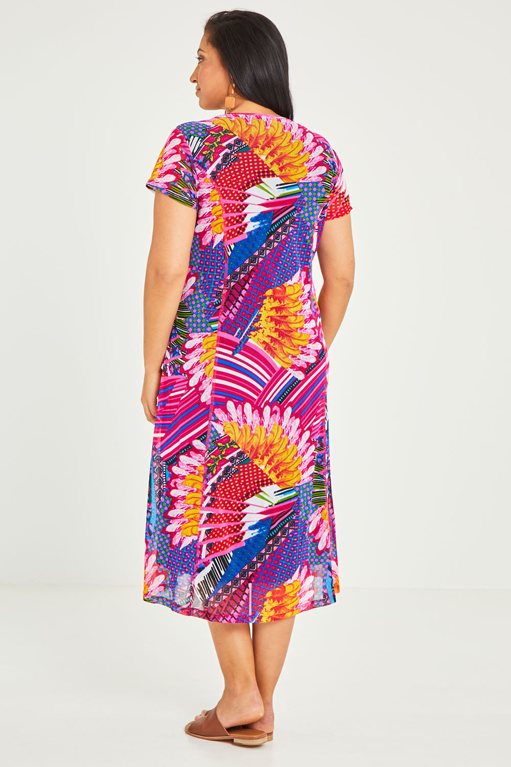 Model Terri-Leigh wearing size 14 of the Panel Mesh Dress in colour Hotpink (Pink), from the back
