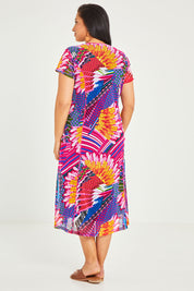 Model Terri-Leigh wearing size 14 of the Panel Mesh Dress in colour Hotpink (Pink), from the back