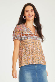 Model Stacey wearing size 10 of the Summer Top in colour Toffee, from the front, cropped image