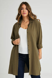 Model Laura wearing size 14 of the Splice Print Tunic Shirt in colour Khaki (Green), from the front, cropped image