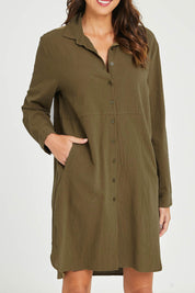 Model Madeline wearing size 10 of the Splice Print Tunic Shirt in colour Khaki (Green), from the front, cropped image