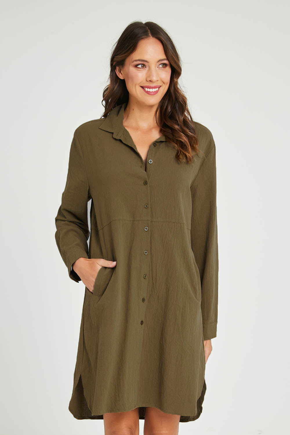 Model Madeline wearing size 10 of the Splice Print Tunic Shirt in colour Khaki (Green), from the front, cropped image