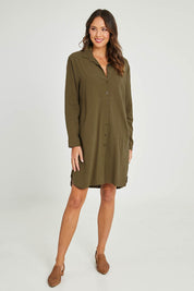 Model Madeline wearing size 10 of the Splice Print Tunic Shirt in colour Khaki (Green), from the front, showing the whole outfit
