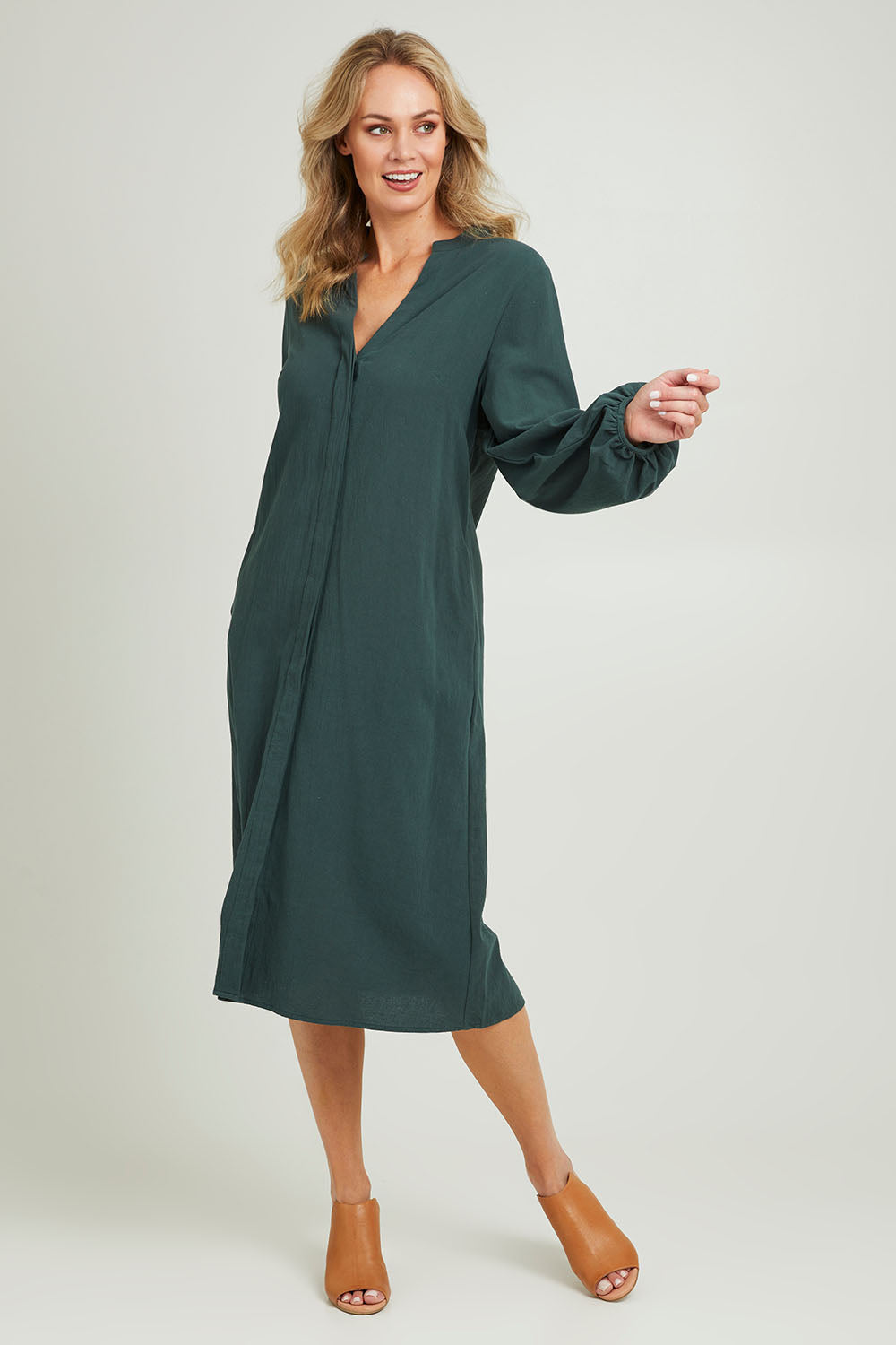 Model Grace wearing size 10 of the Upcycle Midi Shirt Dress in colour Forest (Green), from the front, showing the whole outfit