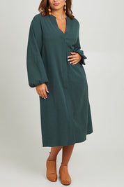 Model Monique wearing size 14 of the Upcycle Midi Shirt Dress in colour Forest (Green), from the front, cropped image