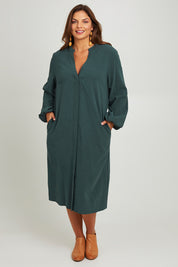 Model Monique wearing size 14 of the Upcycle Midi Shirt Dress in colour Forest (Green), from the front, showing the whole outfit