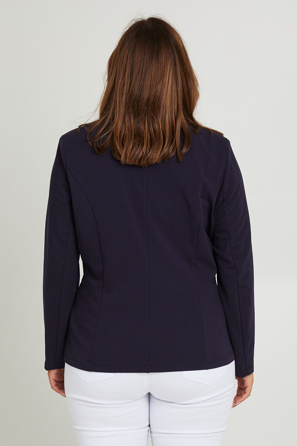 Model Monique wearing size 14 of the Polo Pleasure Jacket in colour Navy (Blue), from the back