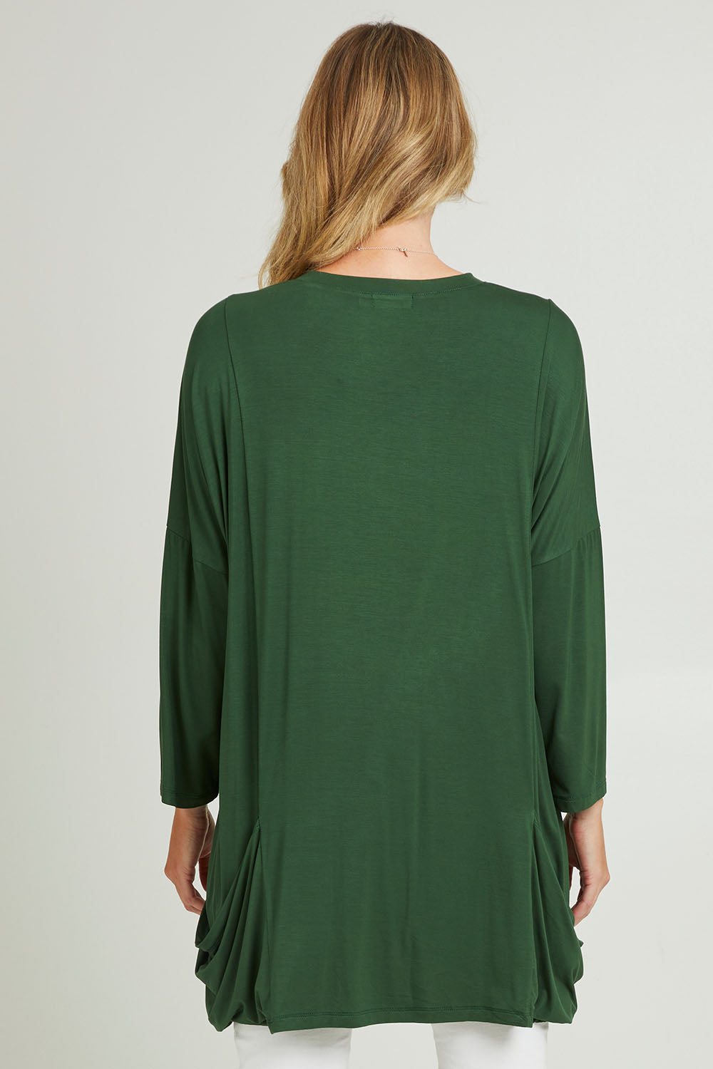 Model Grace wearing size 10 of the Modal Knit L/S Top in colour Green (Green), from the back