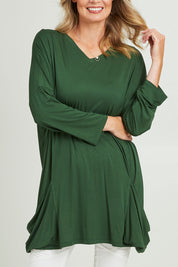 Model Grace wearing size 10 of the Modal Knit L/S Top in colour Green (Green), from the front, cropped image