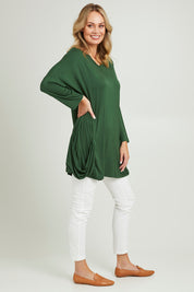 Model Grace wearing size 10 of the Modal Knit L/S Top in colour Green (Green), from the front, showing the whole outfit