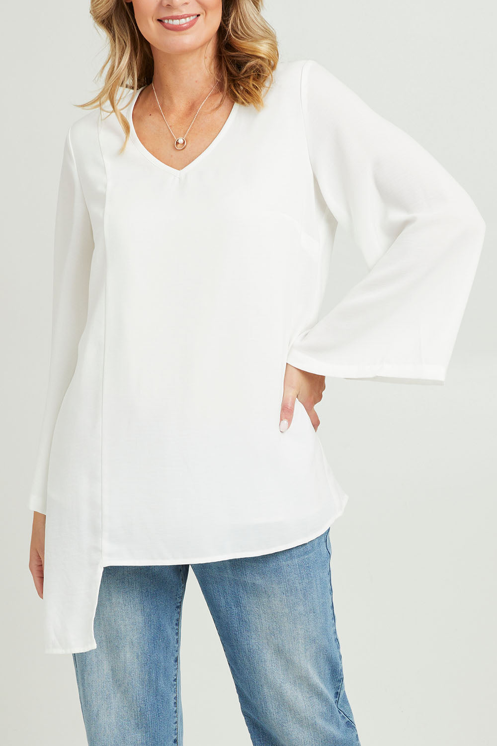 Model Grace wearing size 10 of the Overlay Top in colour White (White), from the front, cropped image