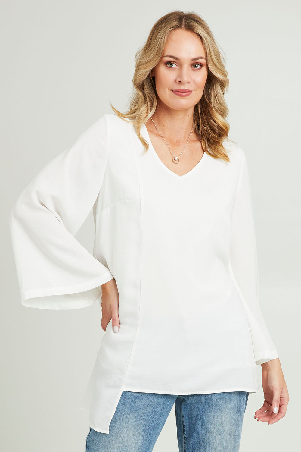 Model Grace wearing size 10 of the Overlay Top in colour White (White), from the front, cropped image