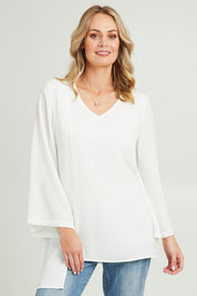 Model Grace wearing size 10 of the Overlay Top in colour White (White), from the front, cropped image