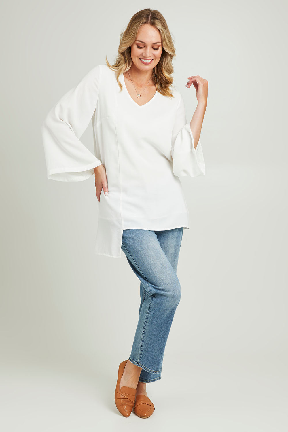 Model Grace wearing size 10 of the Overlay Top in colour White (White), from the front, showing the whole outfit
