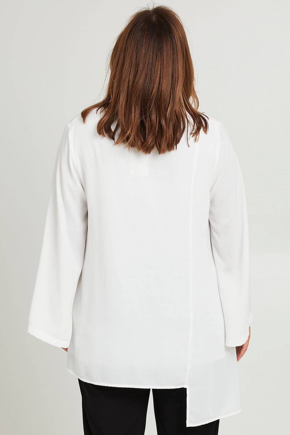 Model Monique wearing size 14 of the Overlay Top in colour White (White), from the back