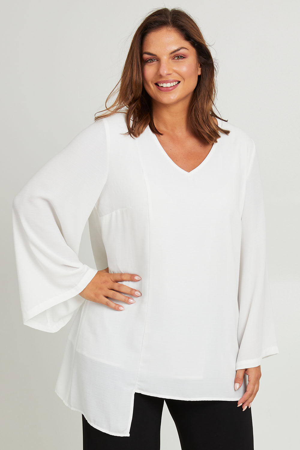 Model Monique wearing size 14 of the Overlay Top in colour White (White), from the front, cropped image