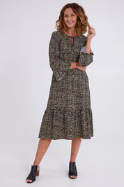 Model Emma wearing size 10 of the Elegantly Waisted Dress in colour Elegantly, from the front, showing the whole outfit